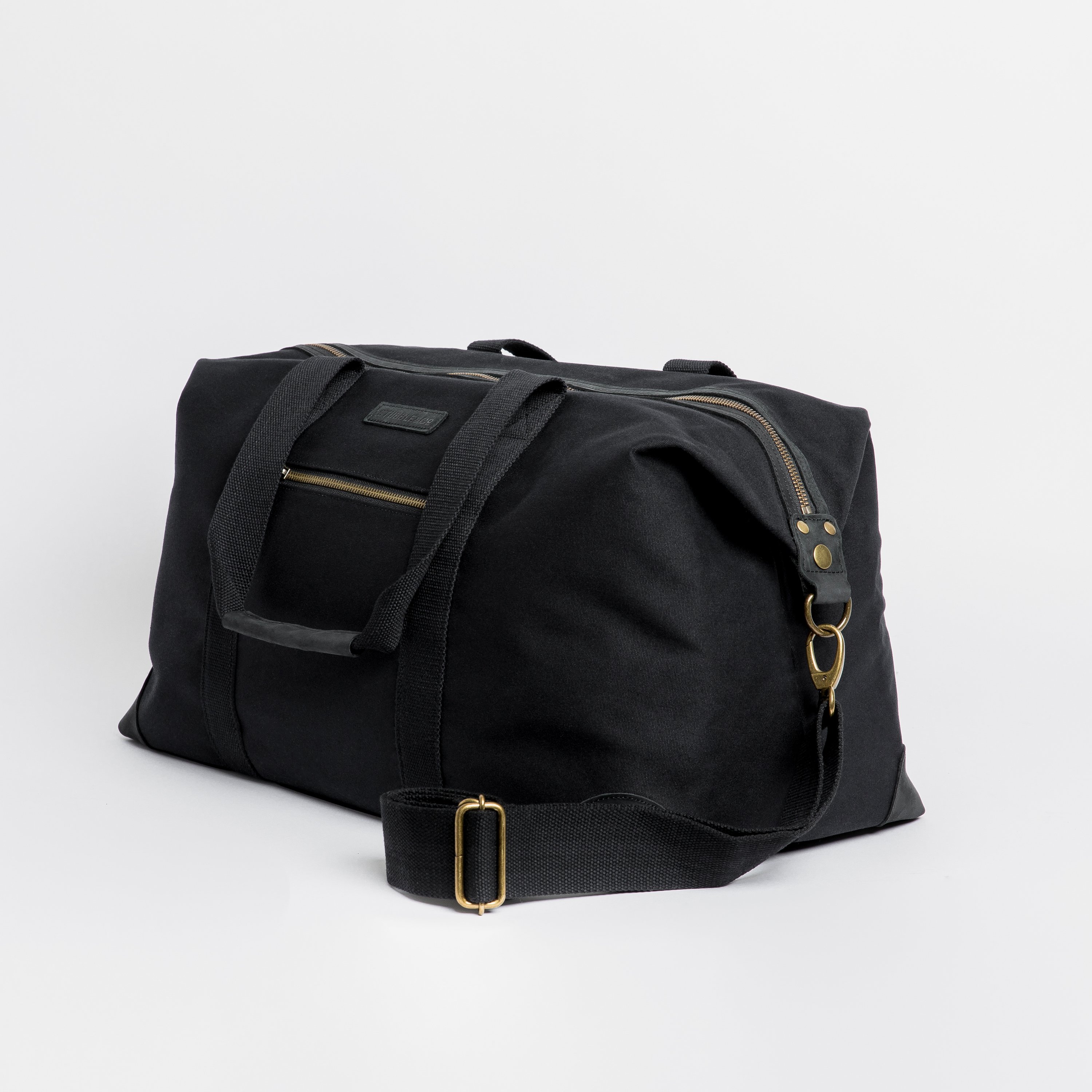 The Weekender. Waterproofed Canvas and Leather Holdall. 15" Laptop Pocket., Black